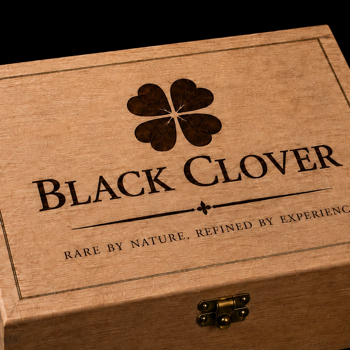 The Black Clover lid engraving on natural cedar